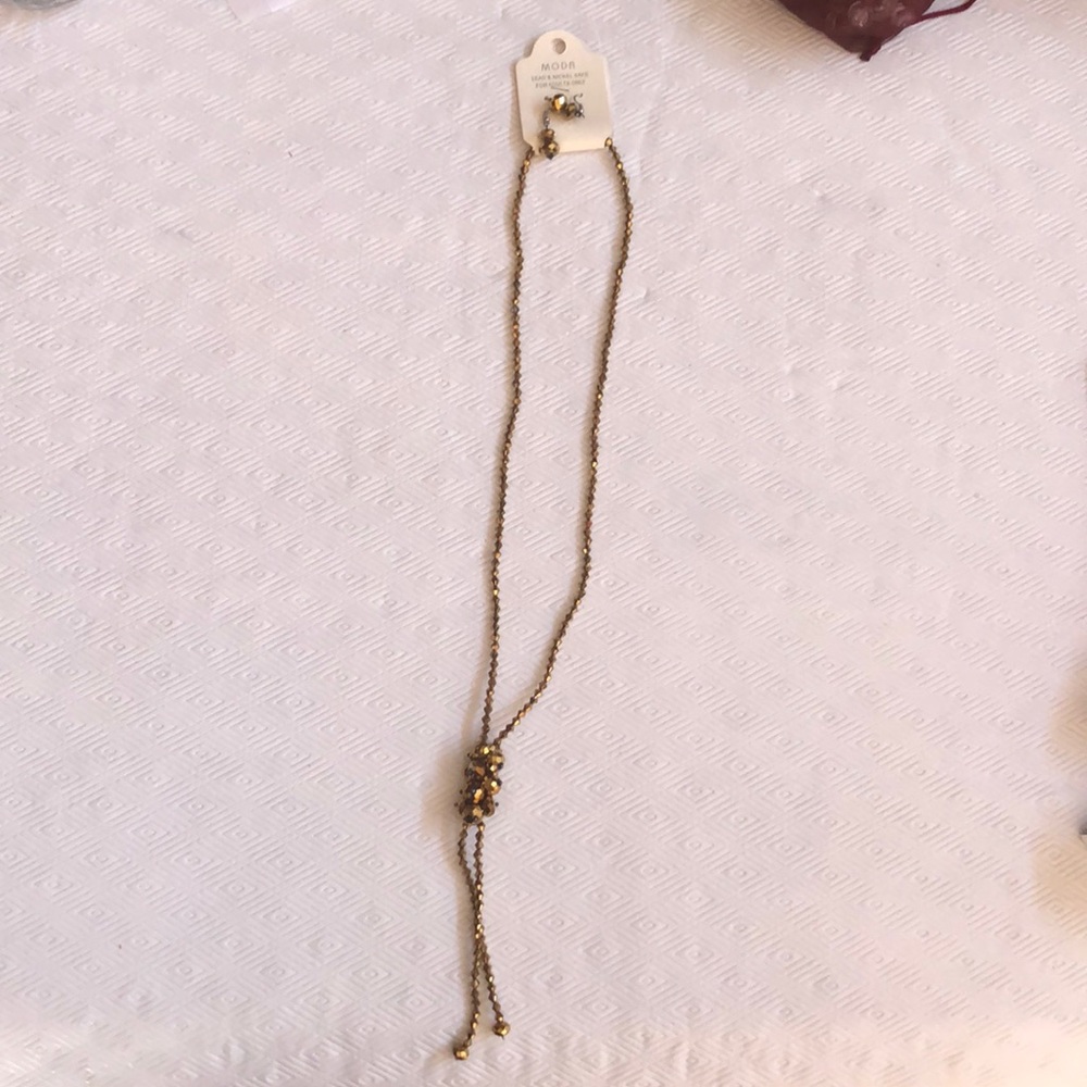 Gold statement necklace and earrings